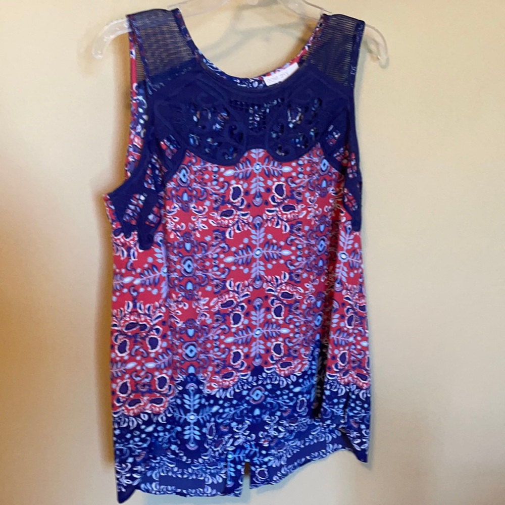 Women’s button back top. Never worn.